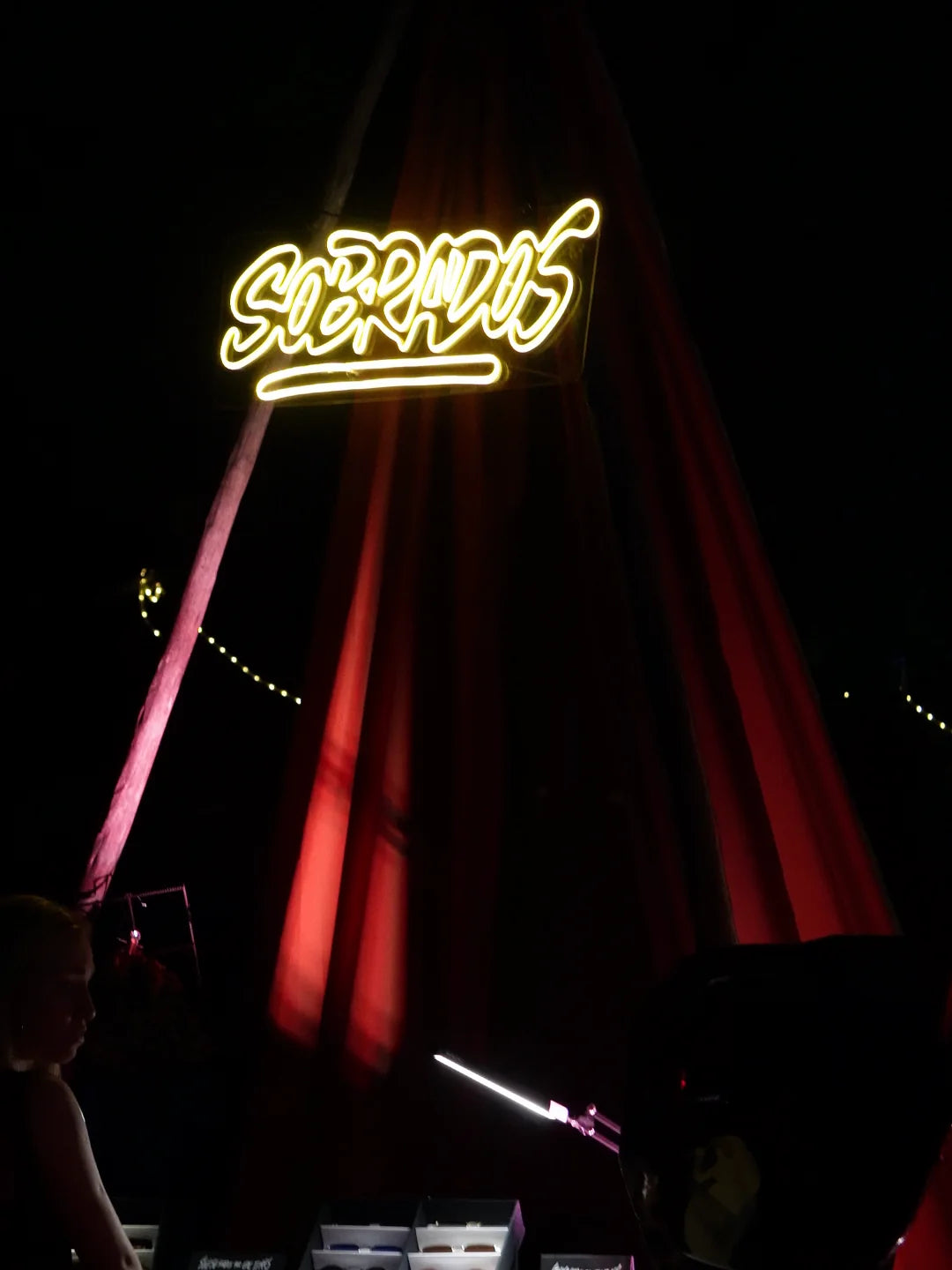 Music Is The Answer neon sign at the Sobrados stand